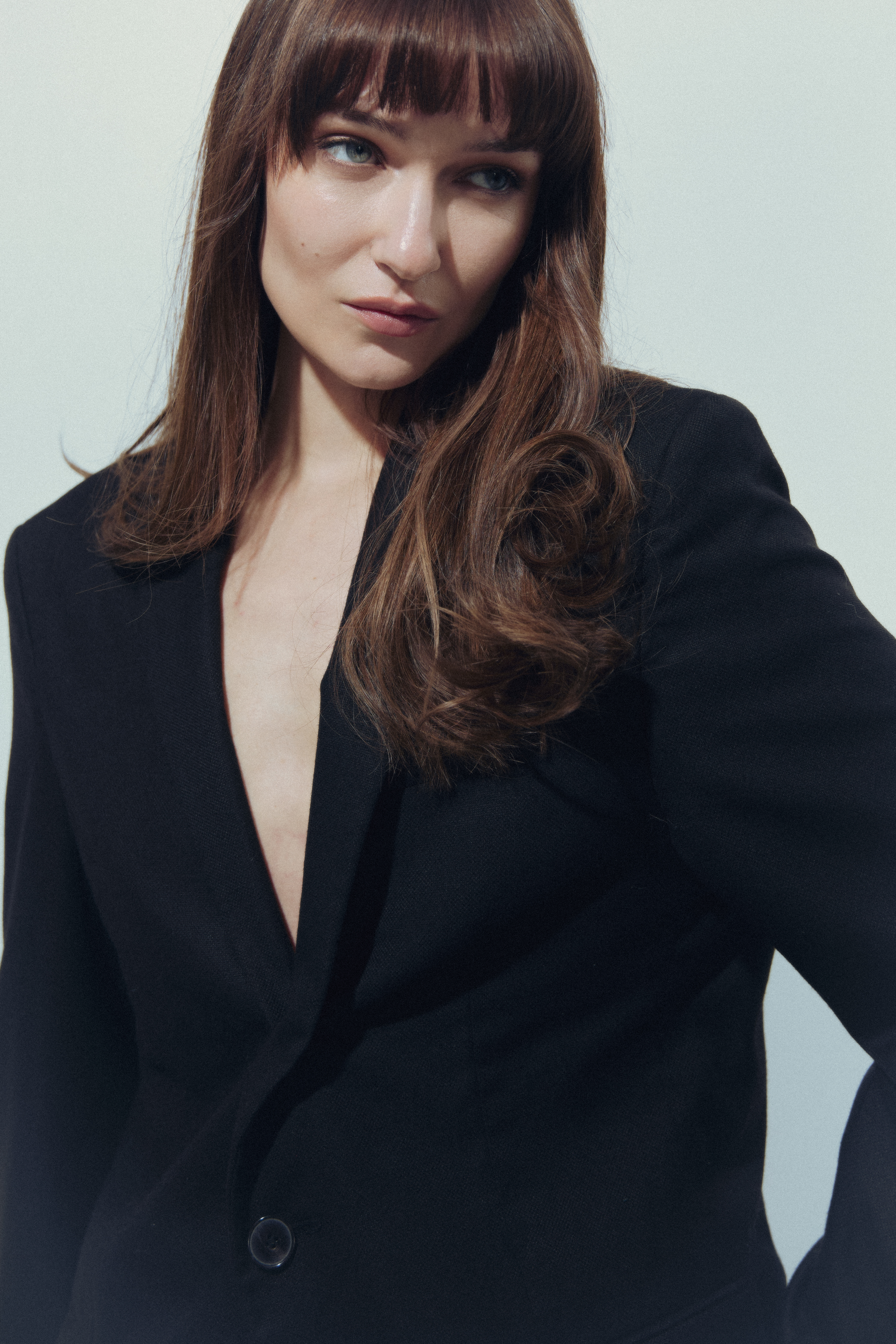 Kris Brouillette in a black blazer, looking off camera